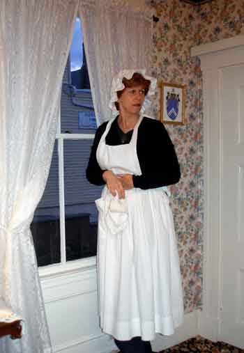 Joanne Giovino tests whether she can see “Andrew” return home while she cleans the window.