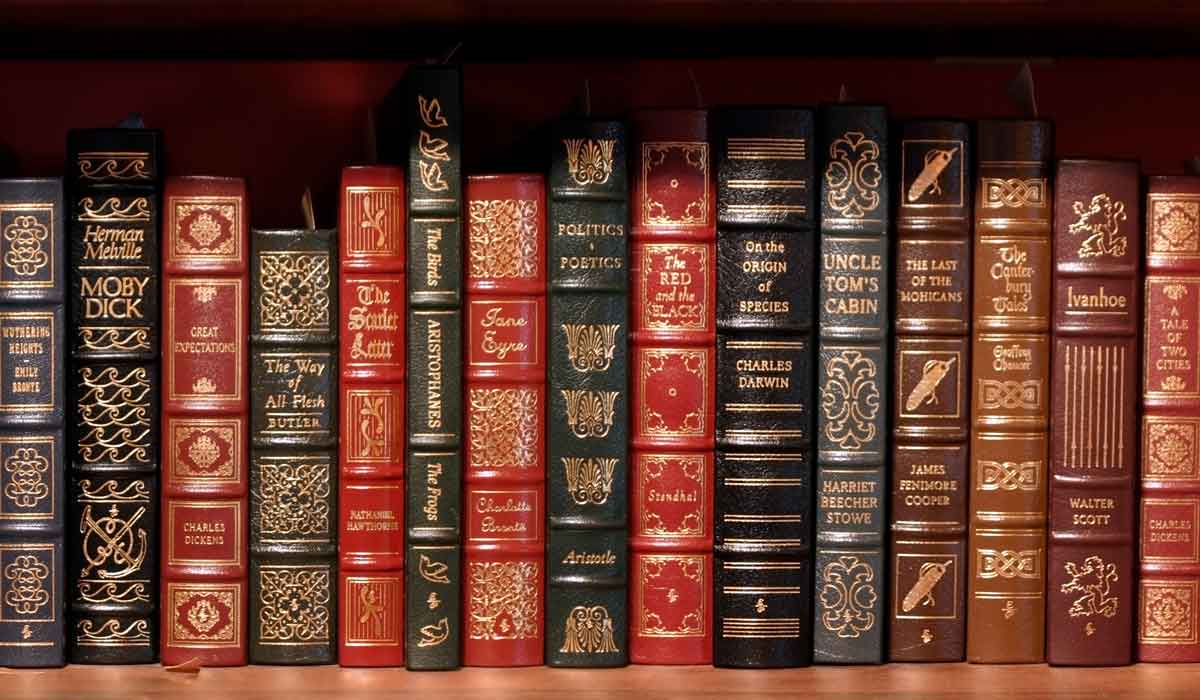 Leather-bound books on a shelf.