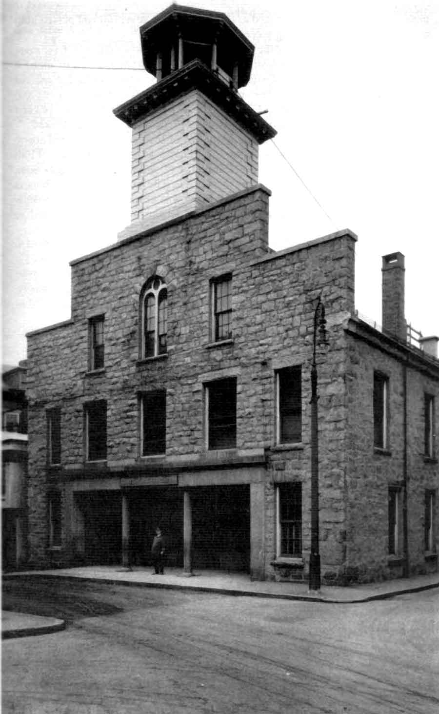Old Police Station, Fall River. Marshal Rufus Hilliard is seen between the columns.