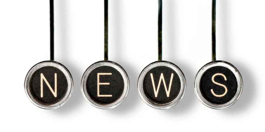 Typewriter keys spelling news.